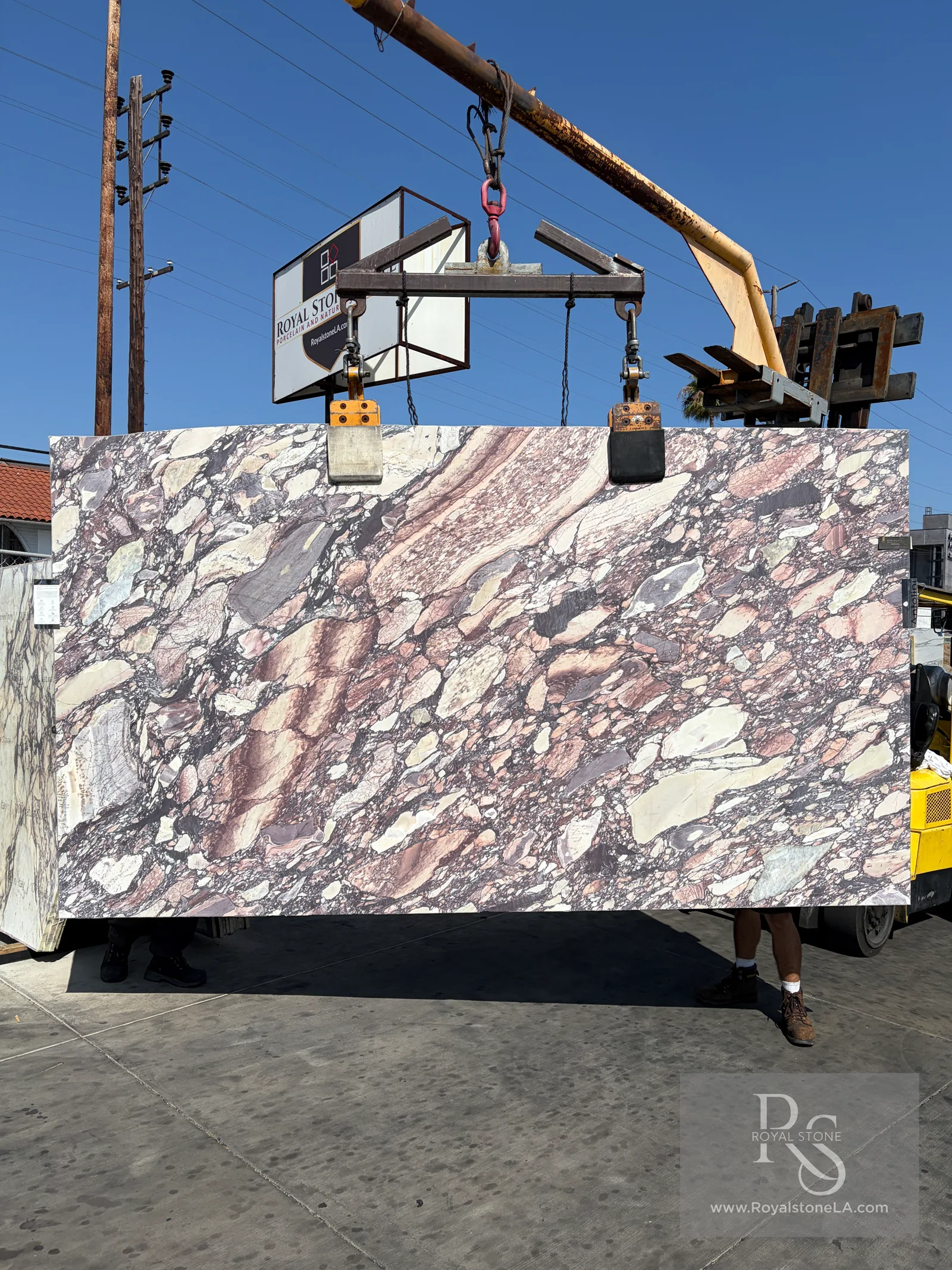 2cm Antolini Calacatta Viola OMG EG859 Super Select honed marble slab, 77 by 136 inches — deep aubergine and near-magenta veining across a clean white Calacatta ground, full slab photographed at the Royal Stone yard in Los Angeles
